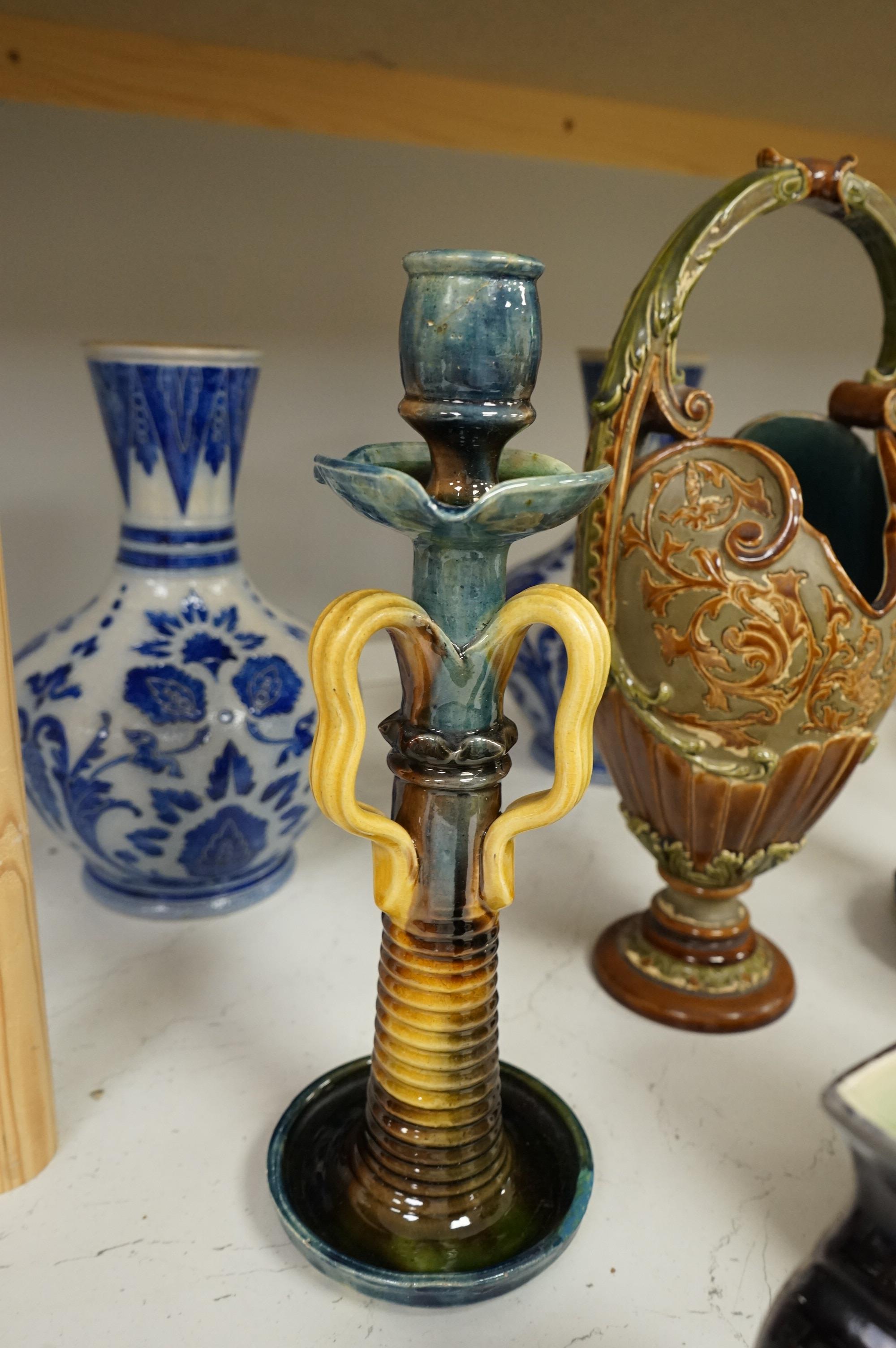 A collection of late 19th century and early 20th century European pottery and stoneware items to include a pair of glazed candlesticks stamped Belgium, largest 36cm high